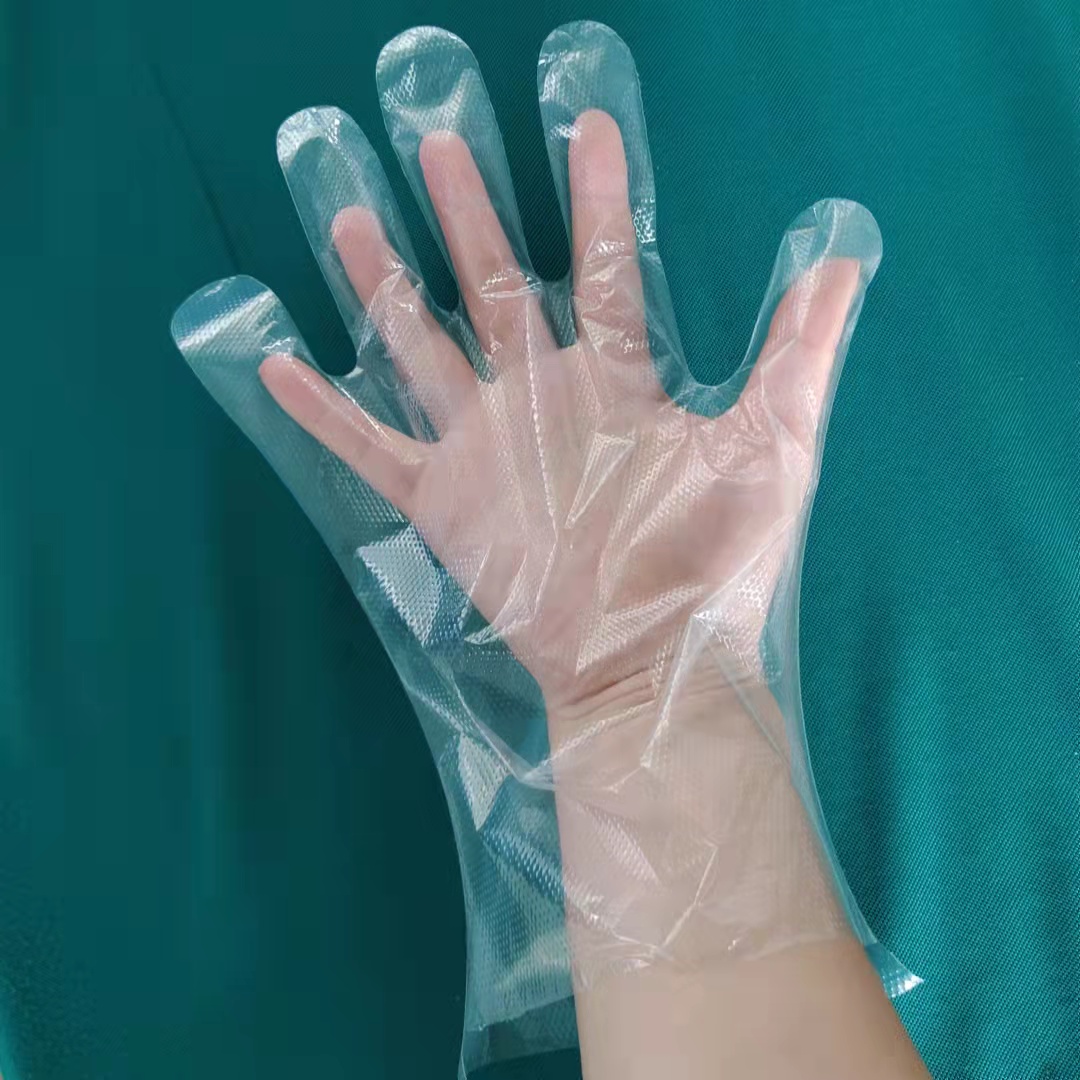 Guanti in plastica trasparente per uso alimentare e medico